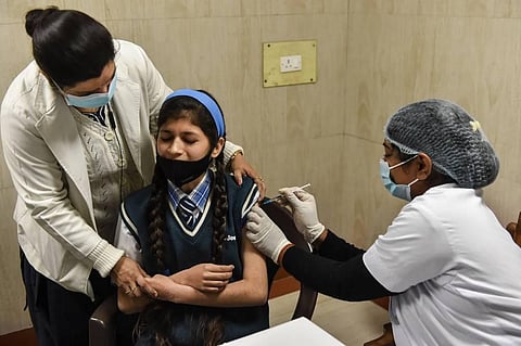 A health worker administers a COVID-19 vaccine to a teenager at SPM Hospital, in Lucknow. (File Photo | PTI)