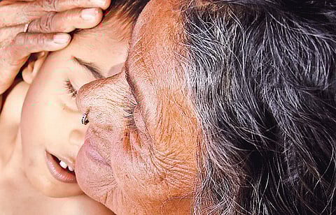 Social activist Daya Bai with an endosulfan-affected girl. (File photo | B P Deepu)