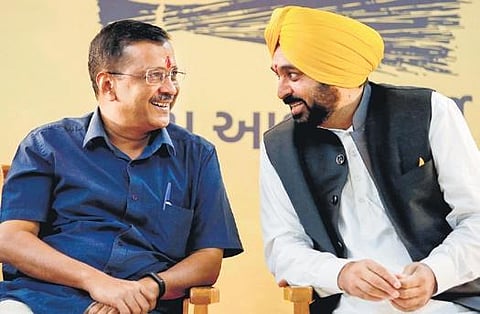 AAP chief Arvind Kejriwal and Punjab CM Bhagwant Mann at a gathering in Ahmedabad. (File Photo| PTI)