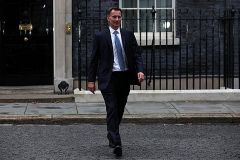 Britain's new Chancellor of the Exchequer Jeremy Hunt leaves 10 Downing Street in central London. (Photo | AFP)