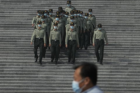 Chinese military officers march down the steps of the Great Hall of the People in Beijing, Tuesday, Sept. 27, 2022. (Photo | AP)