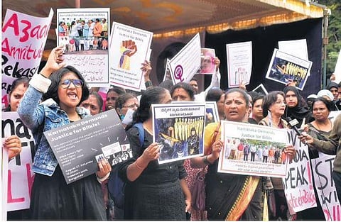 Activists and members of various organisations stage a protest against remission of sentence of Bilkis Bano case convicts, at Freedom Park. (File Photo| EPS)
