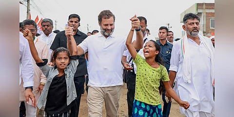 Congress leader Rahul Gandhi with young supporters during the party's 'Bharat Jodo Yatra', in Ballari district. (Photo | PTI)