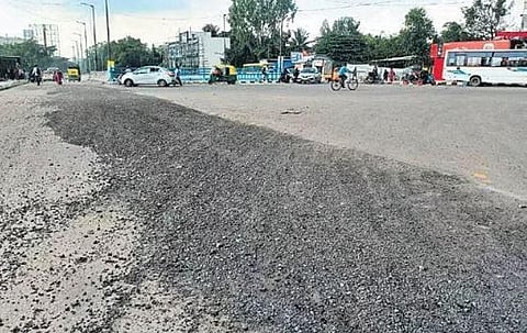 Tar seen peeling off a newly constructed road in Kundalahalli, in Bengaluru on Tuesday | Express