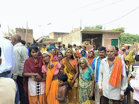 Family members and relatives of Ghatampur accident victims mourn at their Kortha village, in Kanpur district. (Photo | PTI)