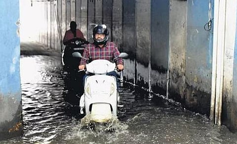 Motorists navigate through a flooded underpass on Sankey Road in Bengaluru on Wednesday | Express