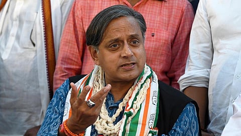 Shashi Tharoor, flanked by his election manager Salman Soz and Kozhikode MP M K Raghavan, speaks to reporters in New Delhi. (Photo | Shekhar Yadav, EPS)