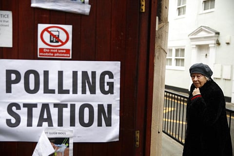 A woman arrives at a polling station in London, Dec. 12, 2019. (File Photo|AP)