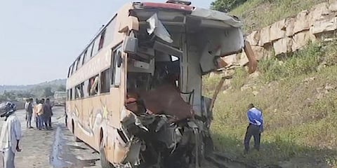 This image from video shows the mangled remains of a bus that collided with a truck on a highway in Rewa district of MP.(Photo | (K K Productions via AP)