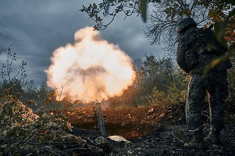 Ukrainian soldiers fire the Russian positions with the mortar in Bakhmut, Donetsk region, Ukraine (Photo | AP)