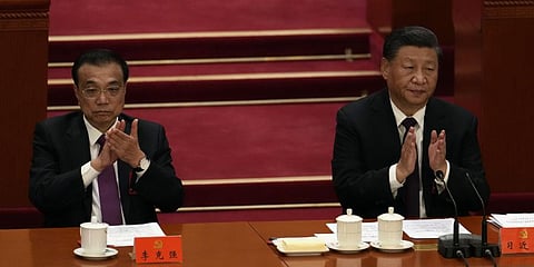 Chinese President Xi Jinping, right, and Premier Li Keqiang attend the closing ceremony of the 20th National Congress of China's ruling Communist Party  in Beijing. (Photo | AP)