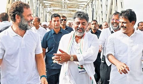 Wayanad MP Rahul Gandhi, KPCC president DK Shivakumar and Rajya Sabha member KC Venugopal share a light moment during the Bharat Jodo Yatra that entered Raichur district on Friday | Express