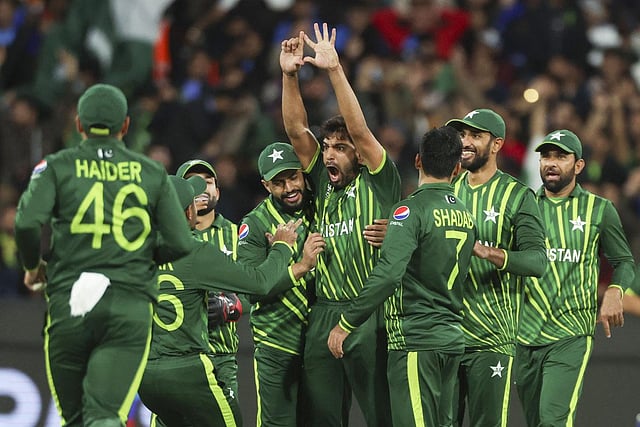 Pakistan's Haris Rauf, centre, celebrates with teammates after taking the wicket of India's Suryakumar Yadav during the T20 World Cup cricket match. (Photo | AP)