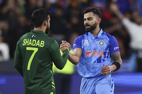 Virat Kohli shakes hands with Pakistan's Shadab Khan following the T20 World Cup cricket match between India and Pakistan in Melbourne. (Photo | AP)