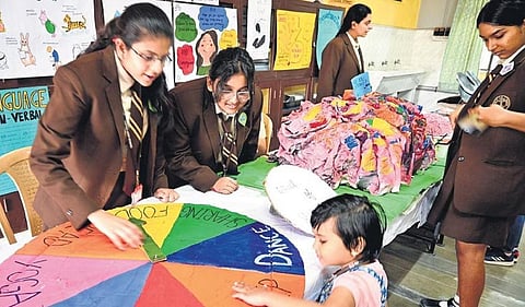 A little visitor checks out an exhibit at Evolet, a science exhibition curated by Class 12 students of Sophia High School, in Bengaluru on Saturday | Shashidhar Byrappa