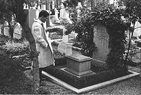 In this undated photo, Pasolini seen at Antonio Gramsci's tomb. (Photo | Wikimedia Commons)