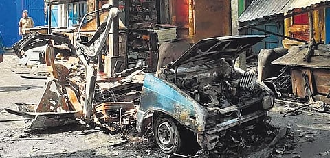 The vehicle burst into two pieces in the impact of the blast. Another unexploded cylinder, steel balls, and nails have been retrieved from the spot . (Photo | S Senbagapandiyan)