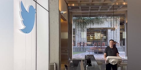Musk entering Twitter headquarters carrying a sink through the lobby area on Wednesday. (Photo | AP)