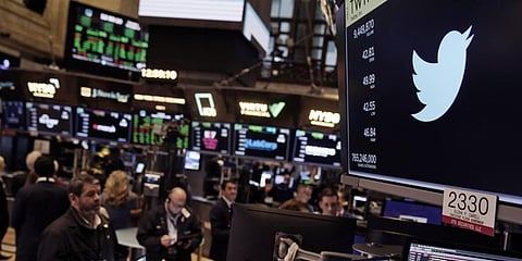 The symbol for Twitter appears above a trading post on the floor of the New York Stock Exchange. (Photo | AP)