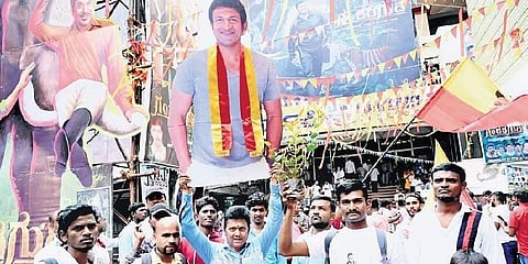 Cutouts of late actor Puneeth Rajkumar adorn Nartaki theatre during the release of ‘Gandhada Gudi’ in Bengaluru on Friday | Nagaraja Gadekal