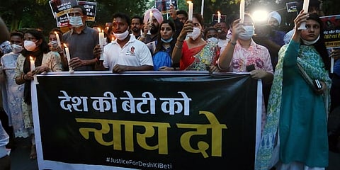 This representational image shows Indian Youth Congress activists during a candle march after a minor girl was allegedly raped and murdered, in New Delhi. (File Photo | PTI)