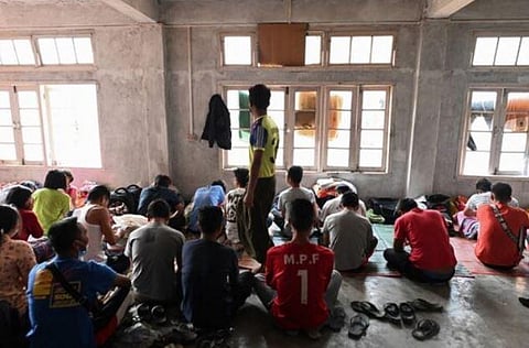 Refugees who fled Myanmar and crossed illegally to India, sit in a temporary shelter at an undisclosed location in India's northeastern state of Mizoram in 2021. (Photo | AFP)