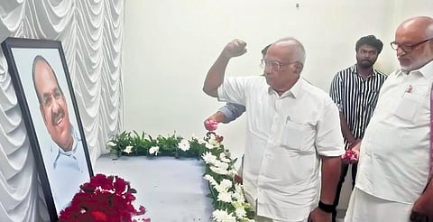 CPM Politburo members S Ramachandran Pillai and M A Baby pay their respects in front of Kodiyeri Balakrishnan’s photo at AKG Centre | Express