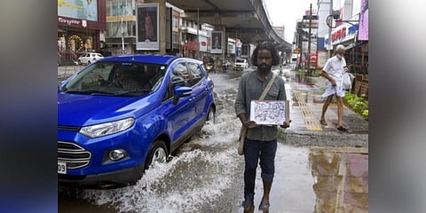 Artist Vishnu Shaji with the sketch he made at MG Road in Kochi. (Photo | A Sanesh )