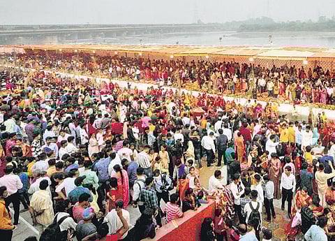 Devotees perform rituals of Chhath Puja on Sunday | PTI