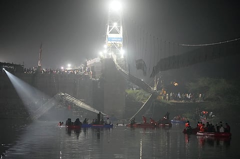 Search and rescue work is going on as a cable suspension bridge collapsed in Morbi town of western state Gujarat, India, Monday, Oct. 31, 2022. (Photo | AP)