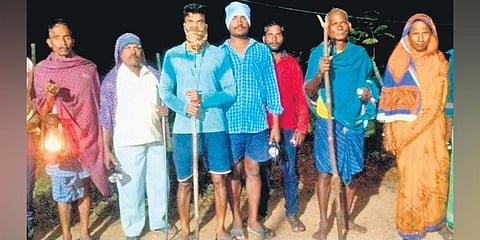 Farmers and villagers patrolling at night to guard their crops in a village | Express