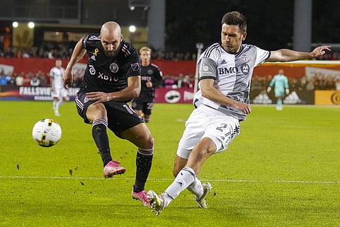 Toronto FC defender Shane O'Neill, right, blocks a shot by Inter Miami forward Gonzalo Higuaín (10) during the first half of an MLS soccer match Friday, Sept. 30, 2022 in Toronto. (Photo | AP)