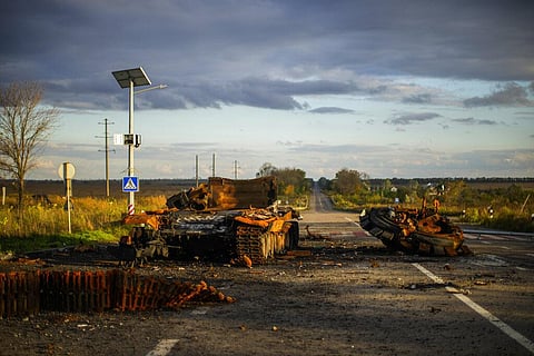 Remains of a destroyed Russian tank are scattered on the ground along the road between Izium and Kharkiv, Ukraine. (Photo | AP)