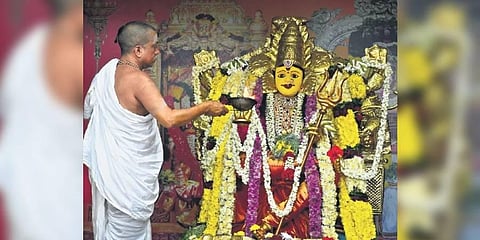 Priest performs puja to Goddess Kanaka Durga on Day-8 of Dasara festivities atop Indrakeeladri in Vijayawada