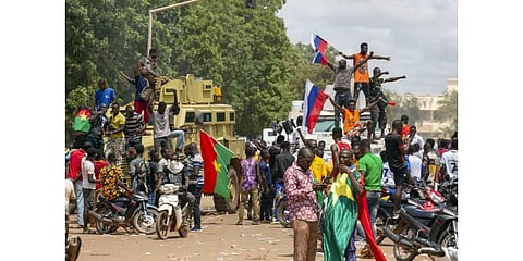 Supporters of Capt. Ibrahim Traore cheer with Russian flags in the streets of Ouagadougou, Burkina Faso. (Photo | AP)