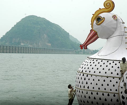 File Photo | Workers giving final touches to Hamsavahanam Teppotsavam along Krishna river in Vijayawada on Friday. Express Photo