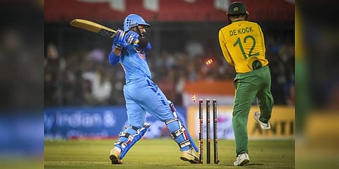 Indian batsman Dinesh Karthik is bowled out by South African bowler Keshav Maharaj during the 3rd T20 cricket match between India and South Africa, at the Holkar Stadium in Indore. (Photo | PTI)