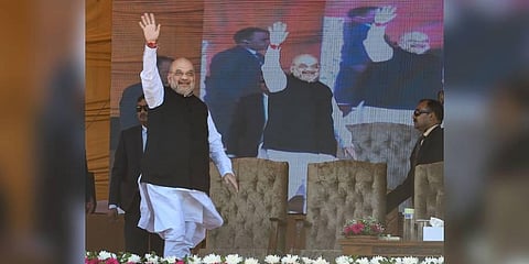 Union Home Minister Amit Shah waves at crowd during a public rally at the Showkat Ali Stadium in Baramulla district of north KashmiR. (Photo | PTI)