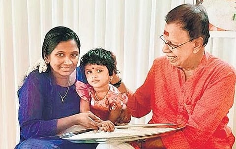 Poet R K Damodaran initiates a child into the world of letters