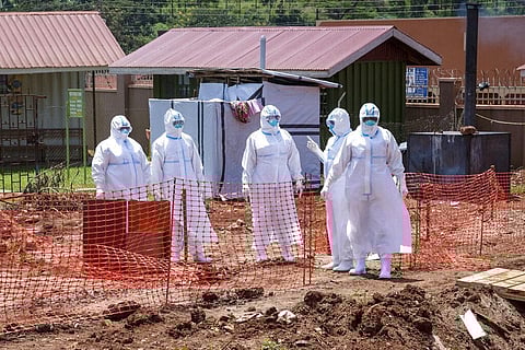 Doctors walk inside the Ebola isolation section of Mubende Regional Referral Hospital, in Mubende, Uganda. (Photo | AP)