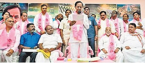 TRS chief K Chandrashekar Rao reads a resolution of the party’s general body to change its name to Bharat Rashtra Samithi, in Hyderabad on Wednesday | PTI