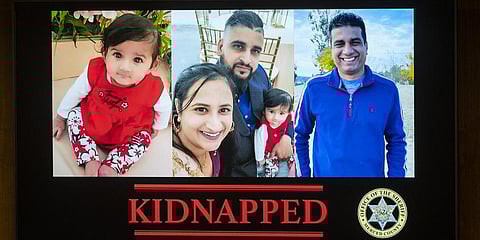 Images are displayed of the Indian-Origin family who was kidnapped at a news conference in Merced, California.(Photo | AP)