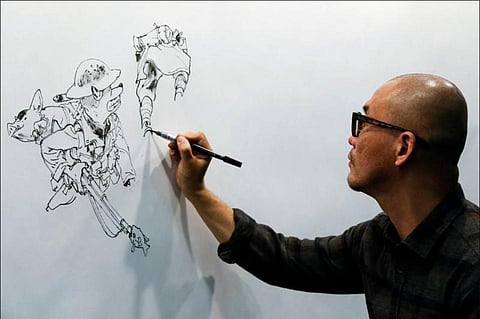 South Korean comic artist Kim Jung Gi draws during the 35th Comic Fair 2017 in Barcelona on March 30, 2017. (Photo | AFP)