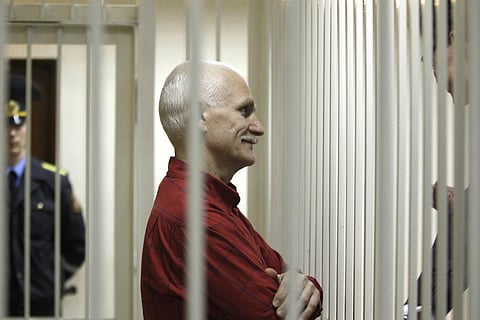 Ales Beliatski, the jailed leader of Vesna, the most prominent human rights group in Belarus, stands in a cage during a court session in Minsk, Belarus, Thursday, Nov. 24, 2011. (Photo | AP)