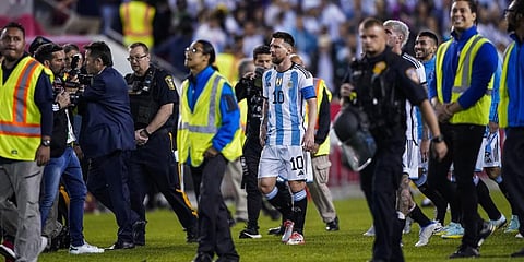 Argentina forward Lionel Messi is escorted off the pitch at the end of the team's international friendly soccer match against Jamaica on Tuesday, Sept. 27, 2022.(Photo | AP)
