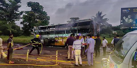 Charred remains of a bus after it hit a truck and caught fire on Aurangabad Road in Nashik district. (Photo | PTI)