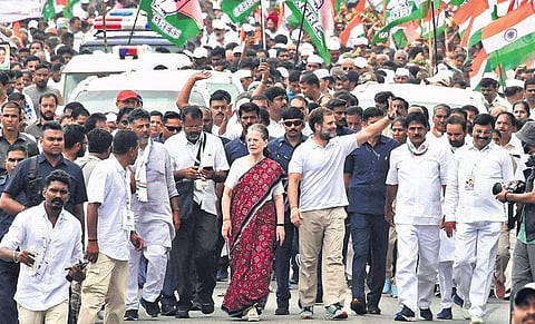 Congress MP Rahul Gandhi walks with his mother and AICC interim president Sonia Gandhi during the Bharat Jodo Yatra at Pandavapura in Mandya district of Karnataka.  (Photo | Udayashankar S)
