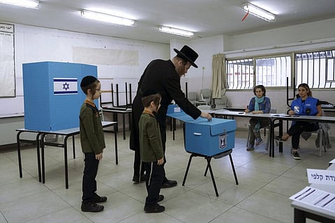 An Ultra-Orthodox Jewish man votes for Israel's parliamentary election at a polling station in Bnei Brak, Israel, Tuesday, Nov. 1, 2022. (Photo | AP)