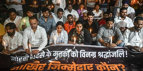 Indian Youth Congress supporters take part in a candlelight march to pay tribute to the victims of Morbi bridge accident at Indian Youth Congress office, in New Delhi. (Photo | ANI)