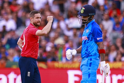England's Chris Woakes celebrates after taking the wicket of India's KL Rahul during the T20 World Cup cricket semifinal between England and India in Adelaide, Nov. 10, 2022. (Photo | AP)